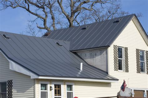 charcoal grey metal roof on white house|dark grey metal roof.